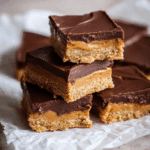 Close-up of no bake peanut butter bars with chocolate topping