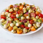 Tomato Cucumber Avocado Salad with Mozzarella and Basil Pesto